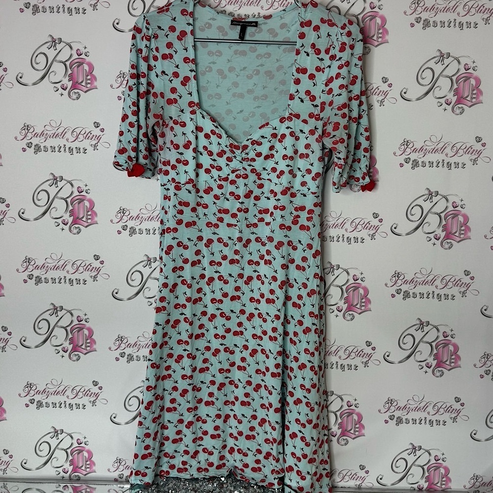 Sourpuss Cherry Print Dress in Light Blue and Red v neck stretchy bows sleeve